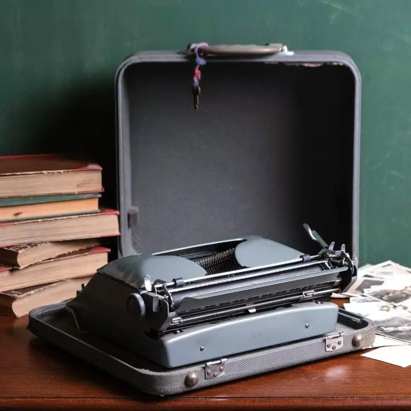 Torpedo brand typewriter with vintage bag.