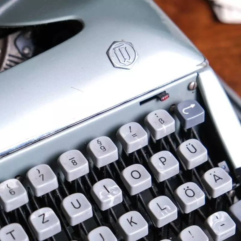 Torpedo brand typewriter with vintage bag.