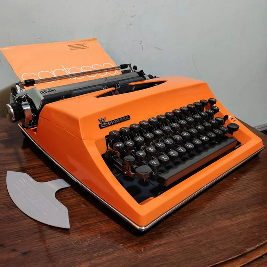 1970's Germany  Triumph brand Contessa De Luxe model portable popart typewriter  Orange color that shows off its clean, flowing lines beautifully