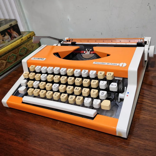1970's Germany  Olympia brand Traveller De Luxe model portable popart typewriter