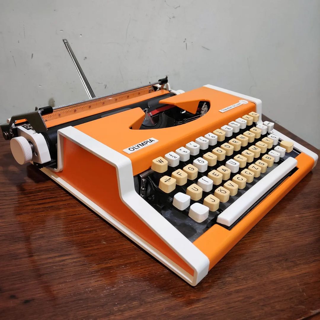 1970's Germany Olympia brand Traveller De Luxe model portable popart typewriter
