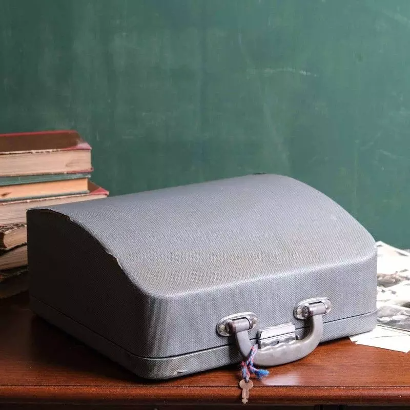 Torpedo brand typewriter with vintage bag.