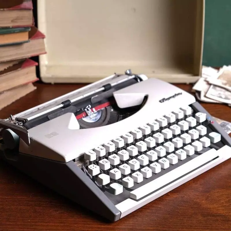 Vintage Olympia brand typewriter with bag.