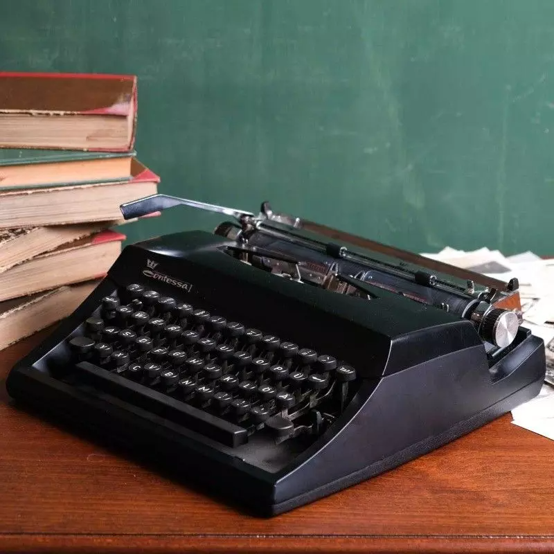 Contessa vintage black typewriter.