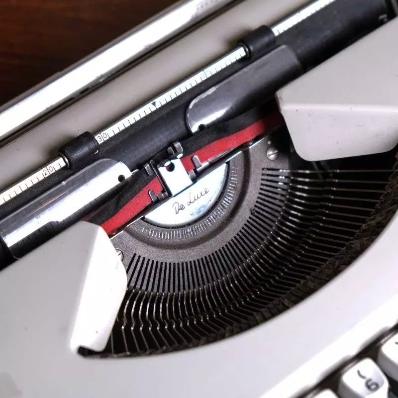 Vintage Olympia brand typewriter with bag.