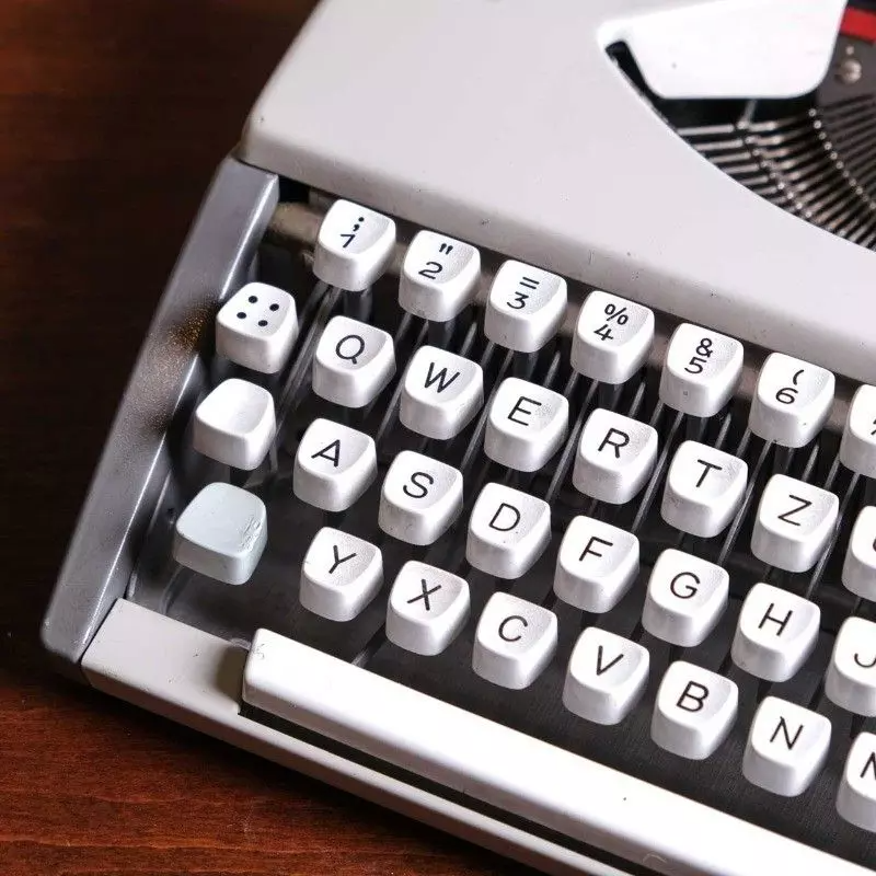 Vintage Olympia brand typewriter with bag.