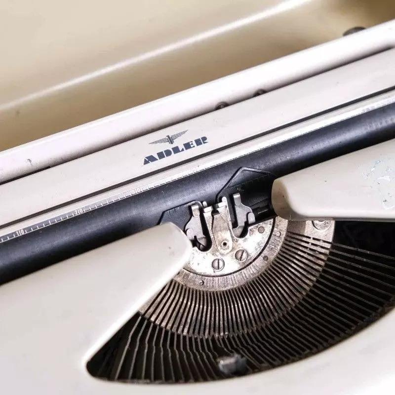 Adler brand typewriter with vintage bag