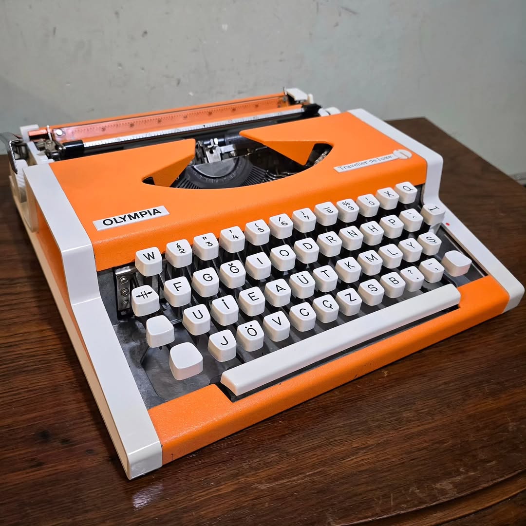 1970's Germany  Olympia brand Traveler De Luxe model portable popart typewriter