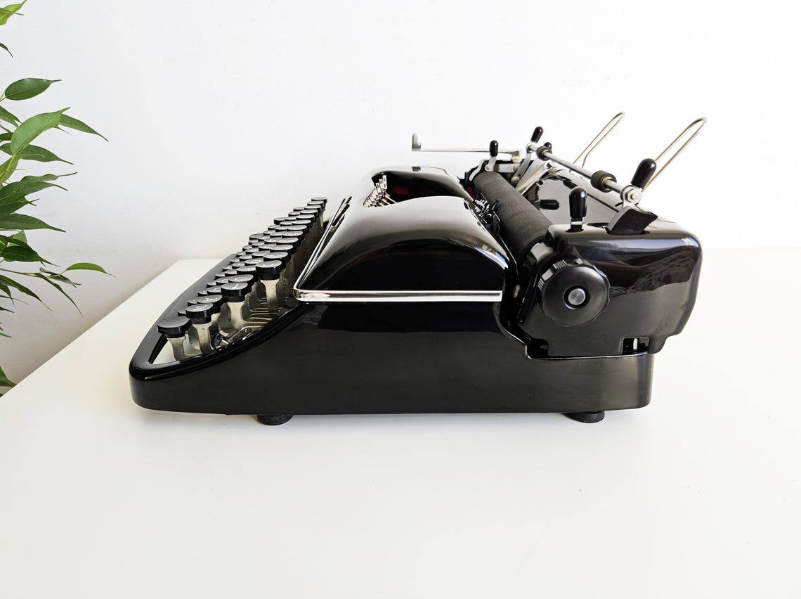 Rheinmetall KST Typewriter, original black color, from the 1950s. With original case. Collectible. Unusual gift.