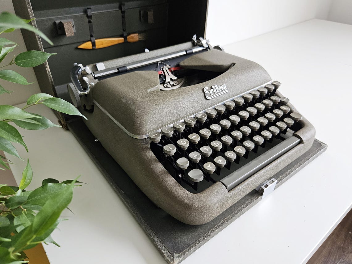 Erika Model 10 a portable working vintage typewriter from the 1950s. In awesome condition, with case, unusual gift, retro office