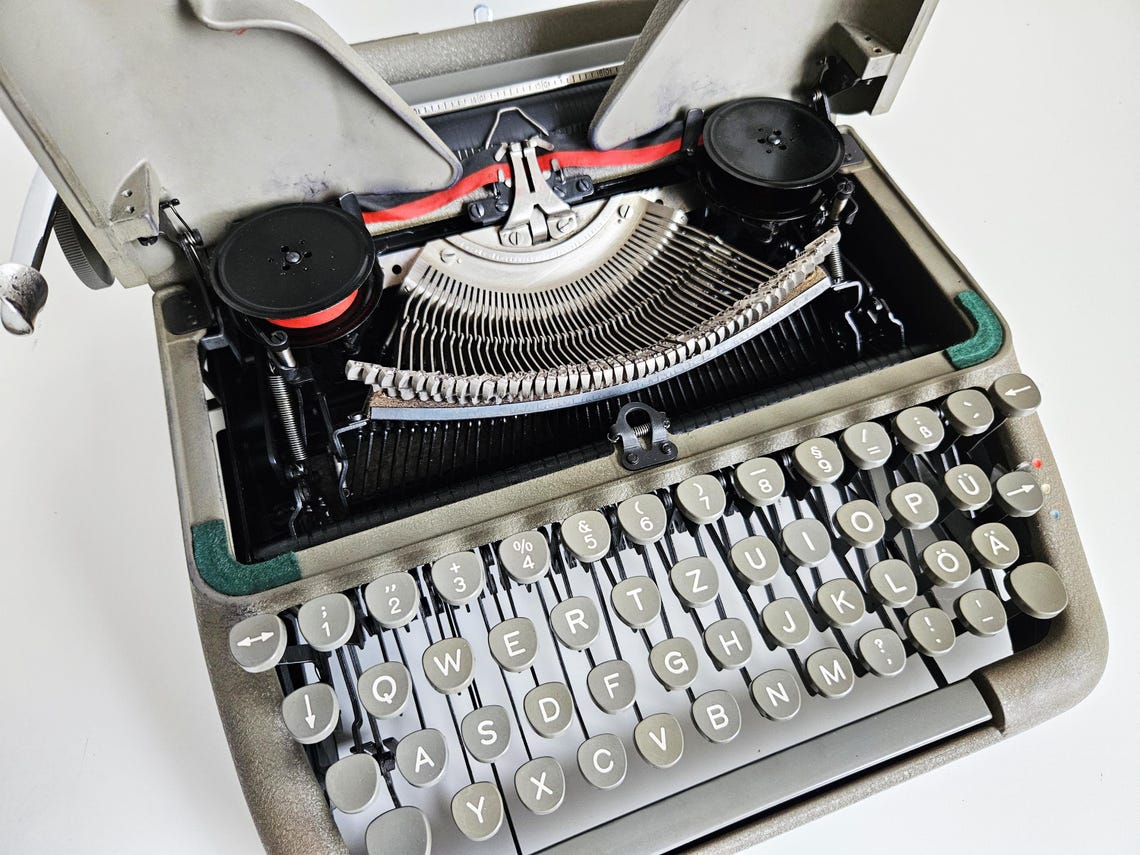 Erika Model 10 a portable working vintage typewriter from the 1950s. In awesome condition, with case, unusual gift, retro office