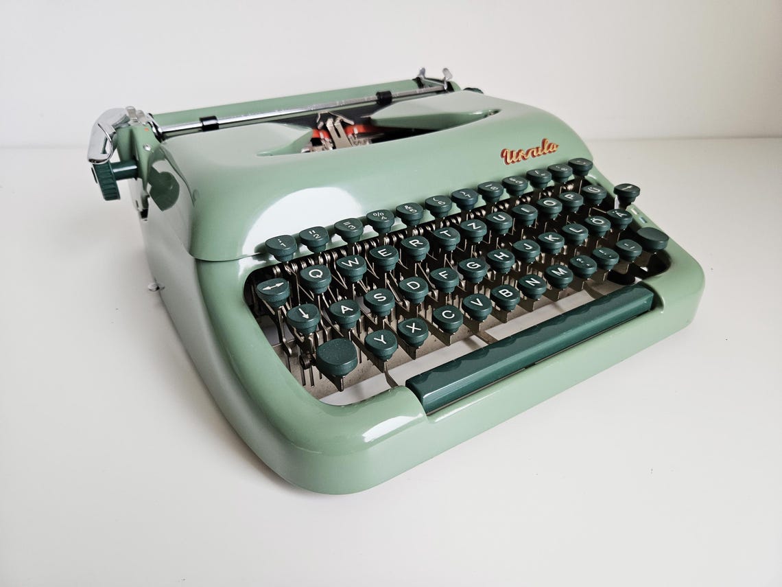Green Ursula portable working vintage typewriter from the 1950s. With case, unusual gift