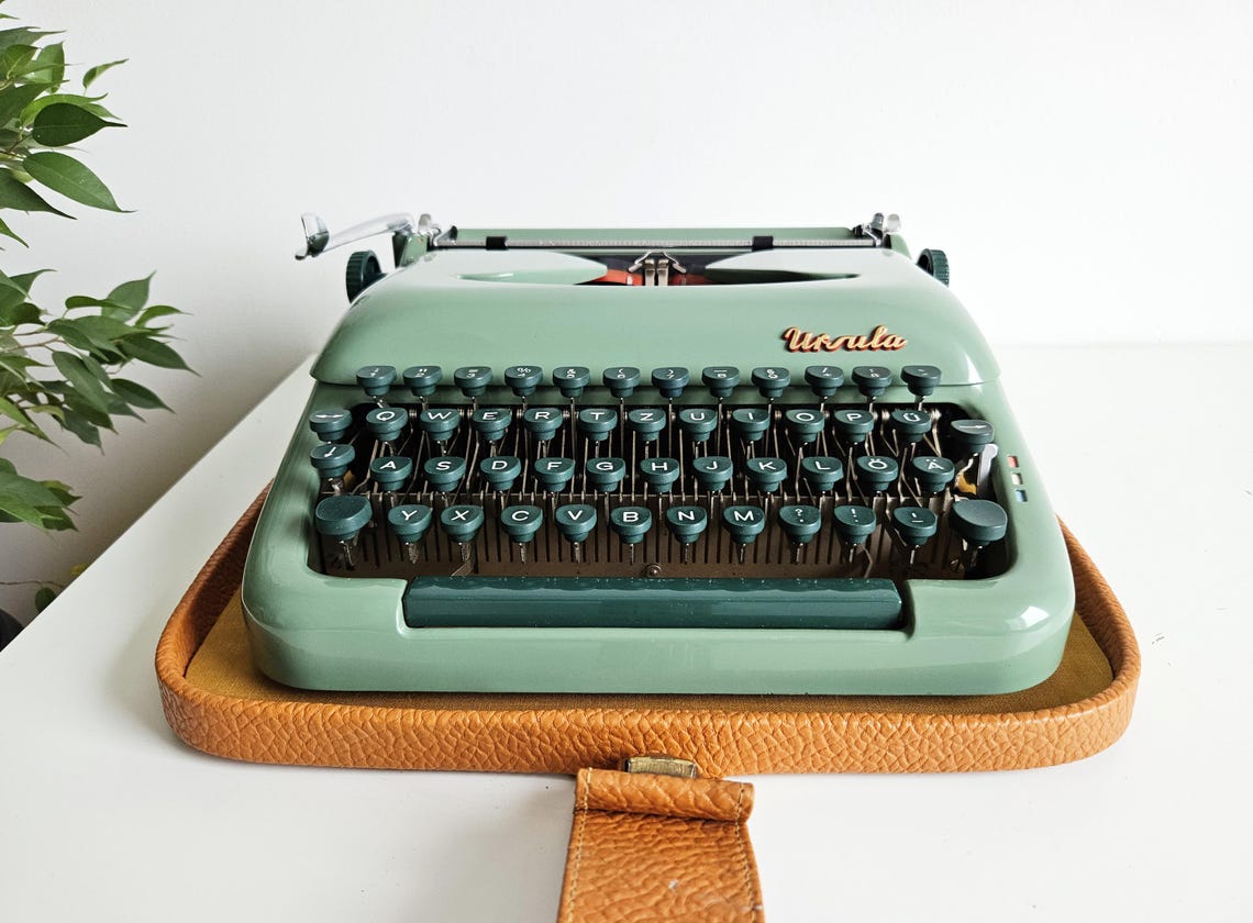 Green Ursula portable working vintage typewriter from the 1950s. With case, unusual gift