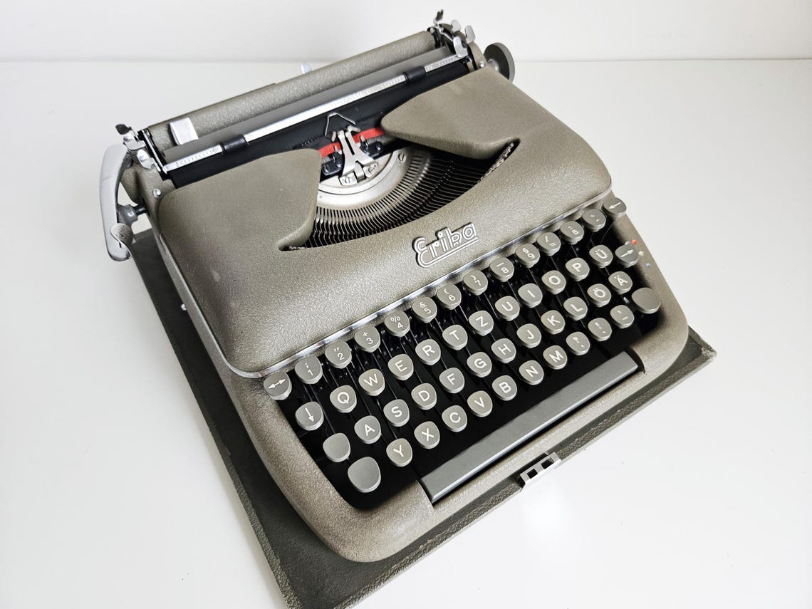 Erika Model 10 a portable working vintage typewriter from the 1950s. In awesome condition, with case, unusual gift, retro office