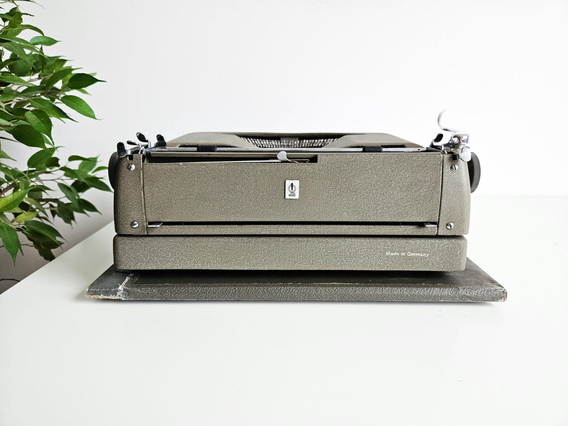 Erika Model 10 a portable working vintage typewriter from the 1950s. In awesome condition, with case, unusual gift, retro office
